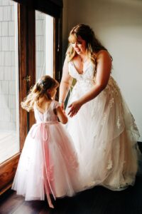 Bride dancing with her daughter in the Casino Suite at Kwataqnuk Resort in Polson, MT