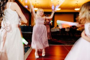 Little girls dancing at wedding at Kwataqnuk Resort