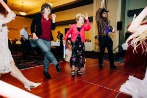 Grandma and guests dancing at Kwataqnuk Resort wedding reception