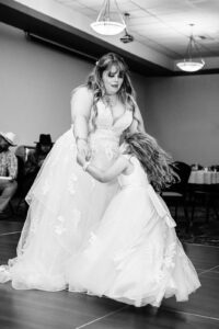 Bride dancing with daughter during wedding reception at Kwataqnuk Resort