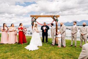 Outdoor wedding ceremony on shore of Flathead Lake at Kwataqnuk Resort