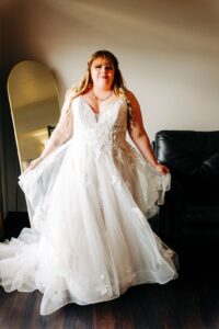 Portrait of bride in her wedding dress in the Casino Suite at Kwataqnuk Resort