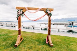 Wedding ceremonial arch at Kwataqnuk Resort on the shore of Flathead Lake in Polson, MT