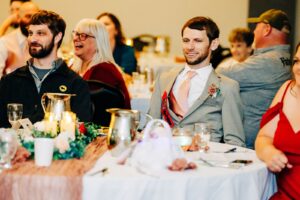 Guests laughing at wedding reception in Western Montana