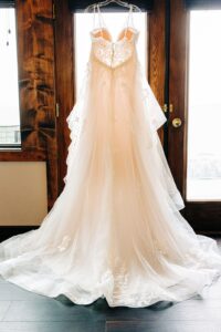 Hanging wedding dress in Casino Suite at Kwataqnuk Resort in Polson, MT