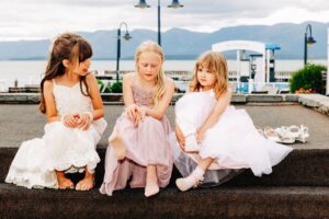 Flower girls sitting outside on patio at Kwataqnuk Resort in Polson, Montana