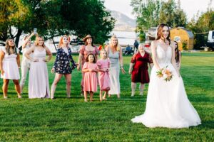 Bouquet toss on lawn at Flathead Lake Forevers in Big Arm, MT