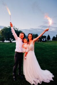 Bride and groom holding sparklers