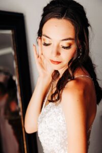 Portrait of bride showing her hair and makeup in bridal suite at Flathead Lake Forevers