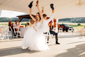 Bride and groom playing the shoe game at wedding reception