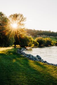 Sunset photo of grounds of Flathead Lake Forevers wedding venue in Big Arm, MT