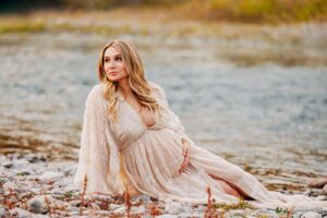 Pregnant Missoula woman on shore of Clark Fork River