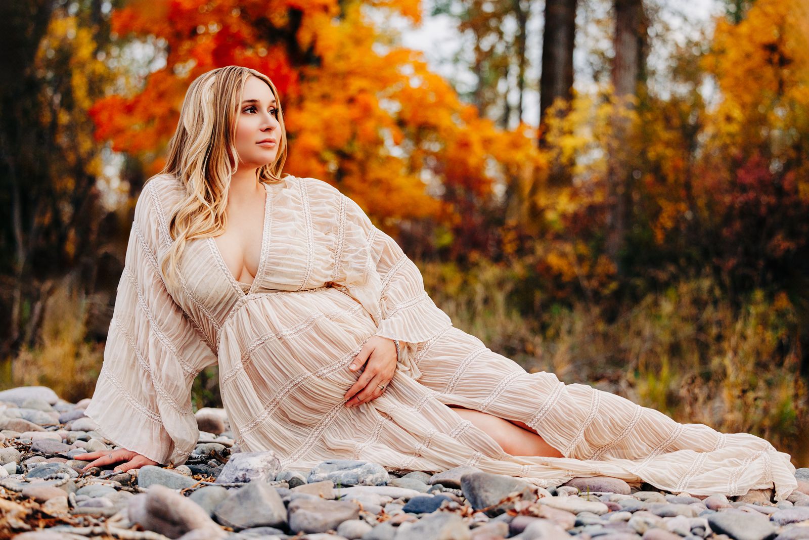 Fall outdoor maternity photo Missoula woman at Kelly Island