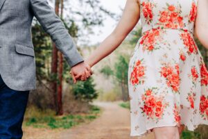 Artistic engagement photo Missoula couple holding hands