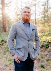 Portrait of engaged Missoula man at Lincolnwood Trailhead