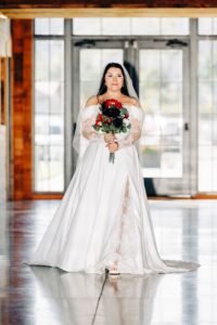 Bride walking down aisle at Snowline Acres indoor wedding ceremony in Kalispell, MT