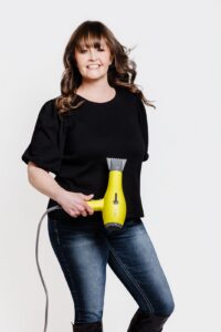 Missoula Drybar hair stylist holding hair dryer