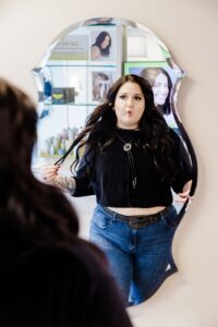 Missoula Drybar hair stylist making funny face in mirror