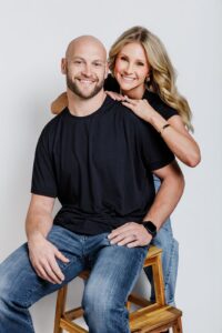 Professional portrait of Missoula Drybar owners Kila and Chase Reynolds on white backdrop