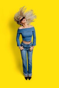 Brand portrait of Missoula Drybar stylist flipping her hair