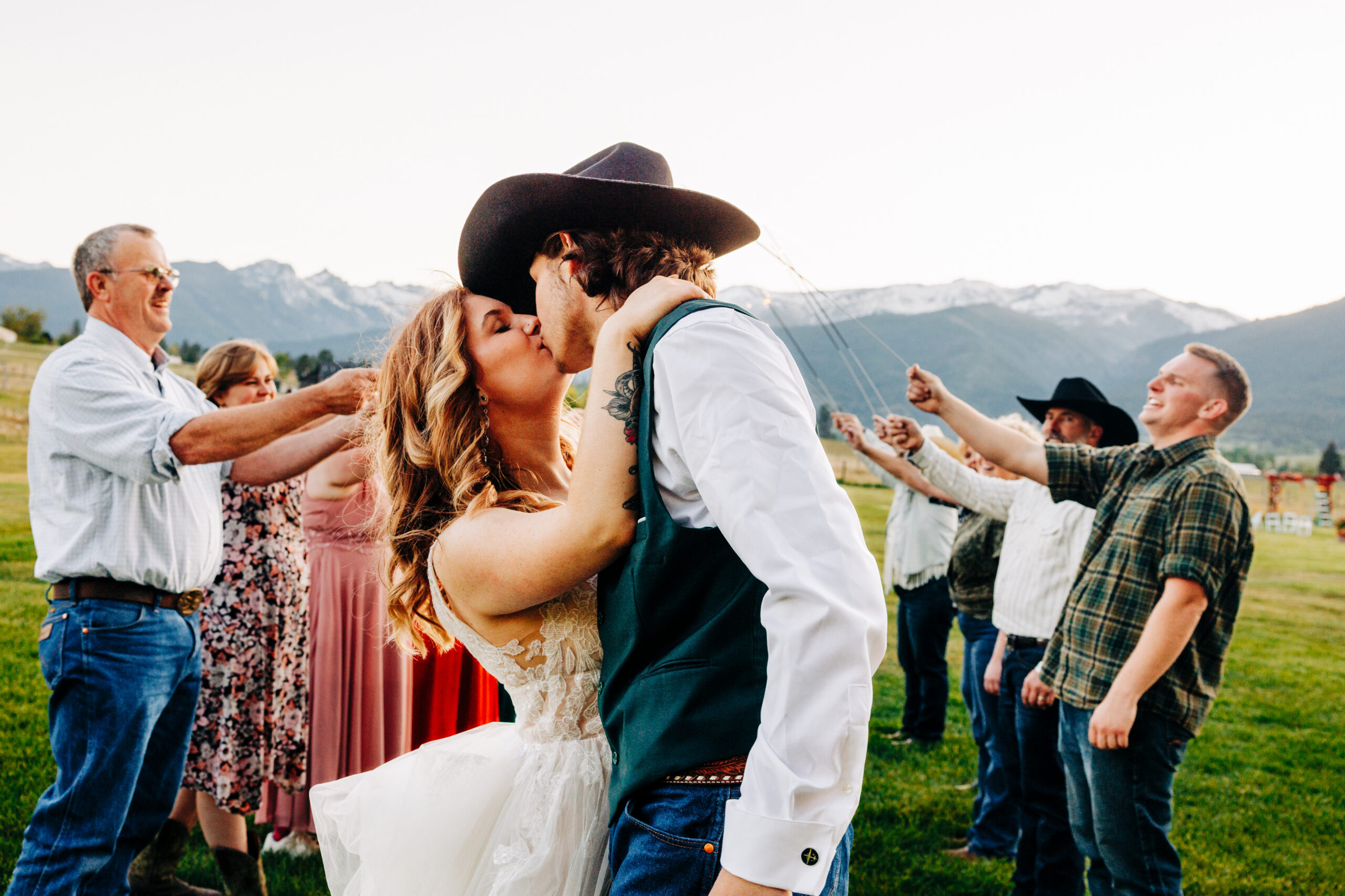 Bride and groom kissing after sparkler tunnel at McVey Homestead wedding venue