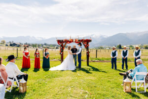 Outdoor wedding ceremony on the lawn at McVey Homestead in Victor, MT