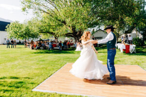 Bride and groom first dance near willow tree at McVey Homestead