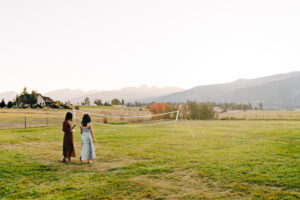 Two guests and volleyball net on the grounds at McVey Homestead in Victor, MT