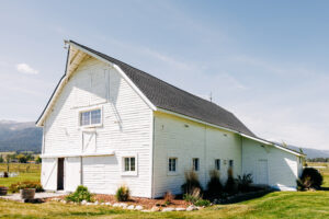 Rustic white barn on property of McVey Homestead wedding venue