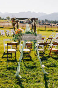 Outdoor ceremony set up, decorations, and seating in the round at McVey Homestead