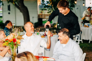 Guests at evening wedding reception at McVey Homestead