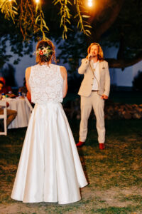 Groom singing to bride at blue hour wedding reception at McVey Homestead